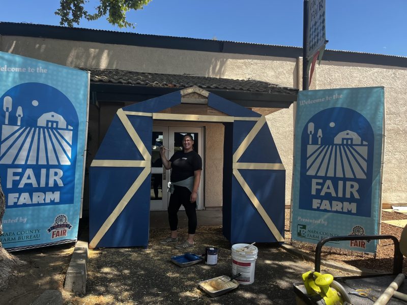 Cierra Warner puts the finishing touches on the Fair Farm entrance. Napa Town & Country Fair photo