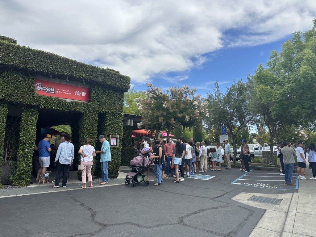 People lined up at Burgers & Half Bottles at 1:45 p.m. on Wednesday, Aug. 6. Lisa Adams Walter photo