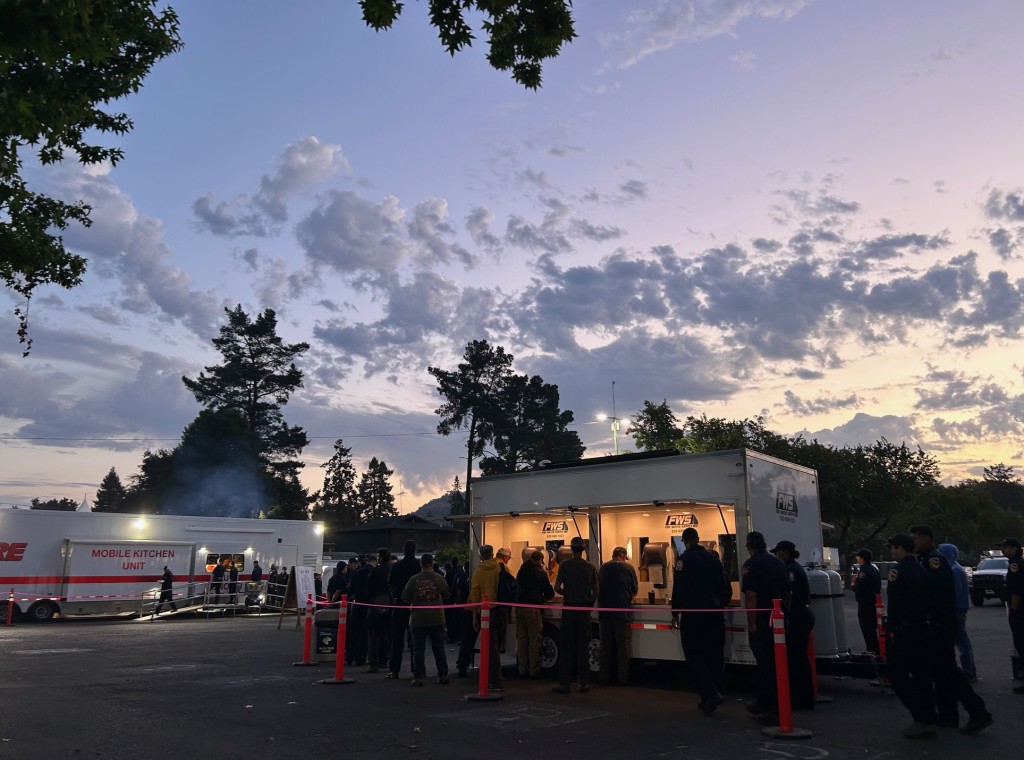 Firefighters wash their hands at a portable station provided by Fire Water Supply Inc. on their way to breakfast, served by inmates from the Konocti Conservation Camp. Kerana Todorov photo