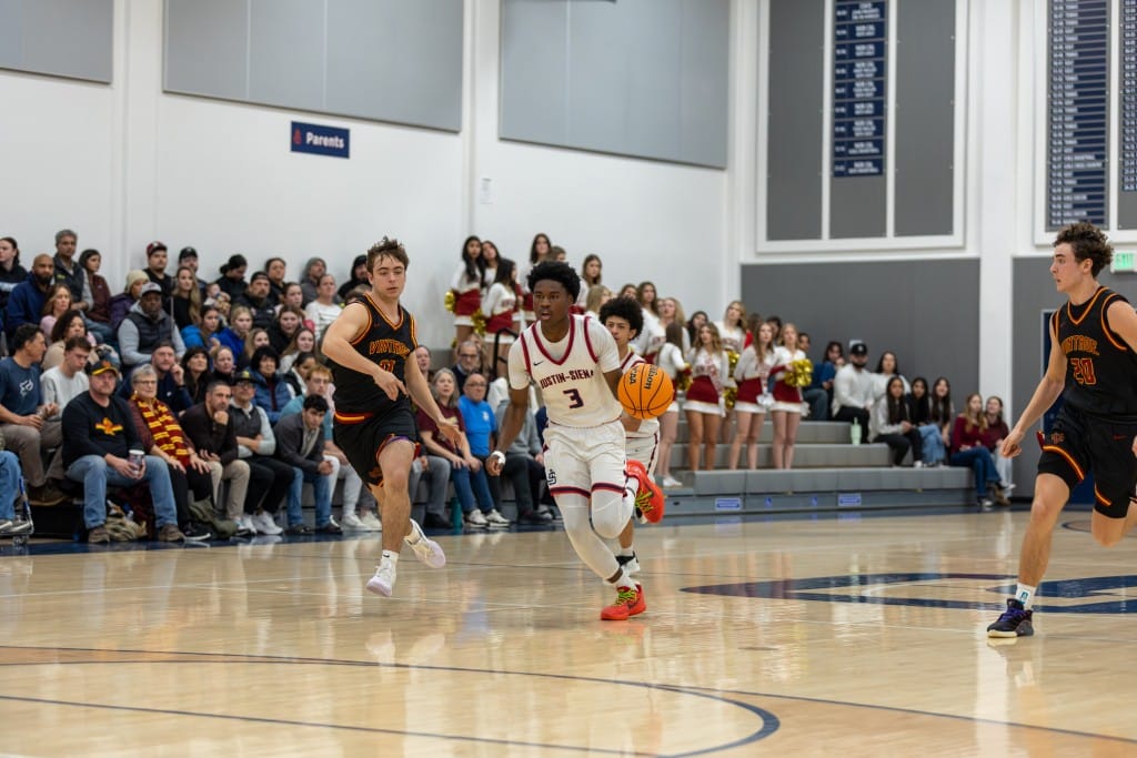 Dylan Arnold of Justin-Siena basketball moves past Vintage High defenders. Eric Thompson, Shamboozled.com photo