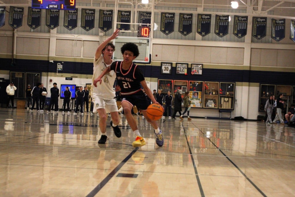 Alijandro Perryman of Justin-Siena dribbles into the key. Kyle Foster photo