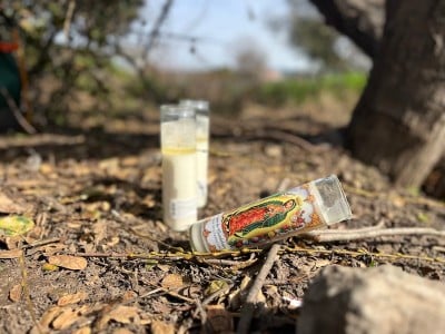 Candles were burned in memory of Luciano Cervantes Garcia, near his tent along Tulocay Creek in Napa. Griffin Jones photo