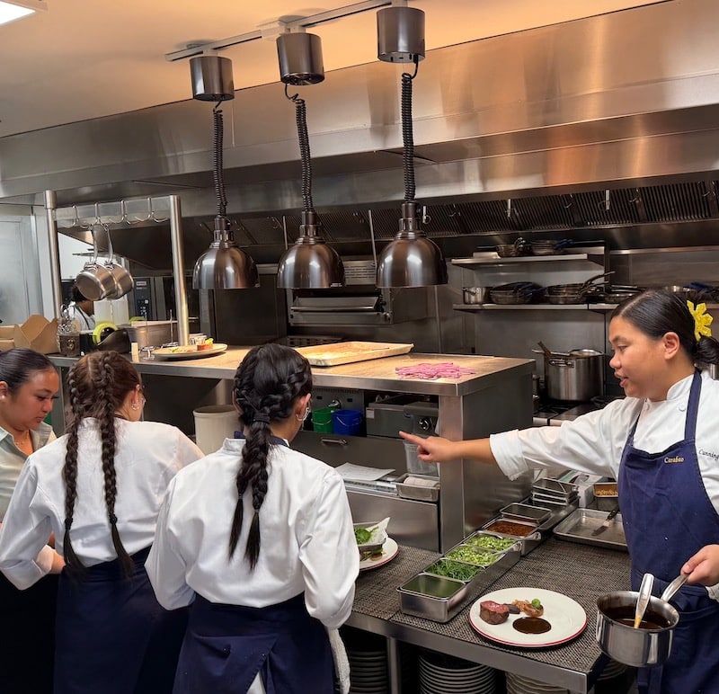 chefs cooking in a kitchen