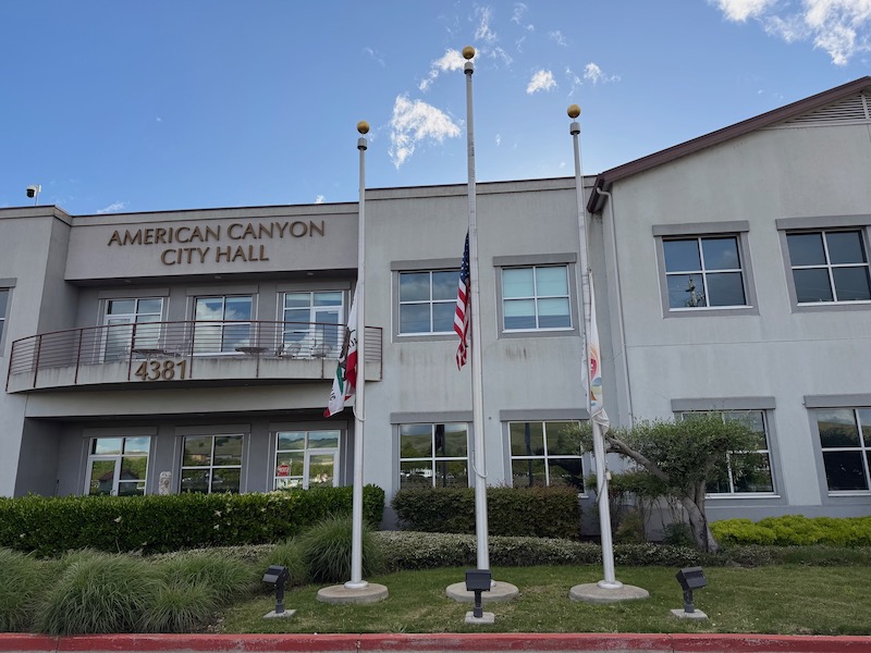 lowered flags in front of city hall