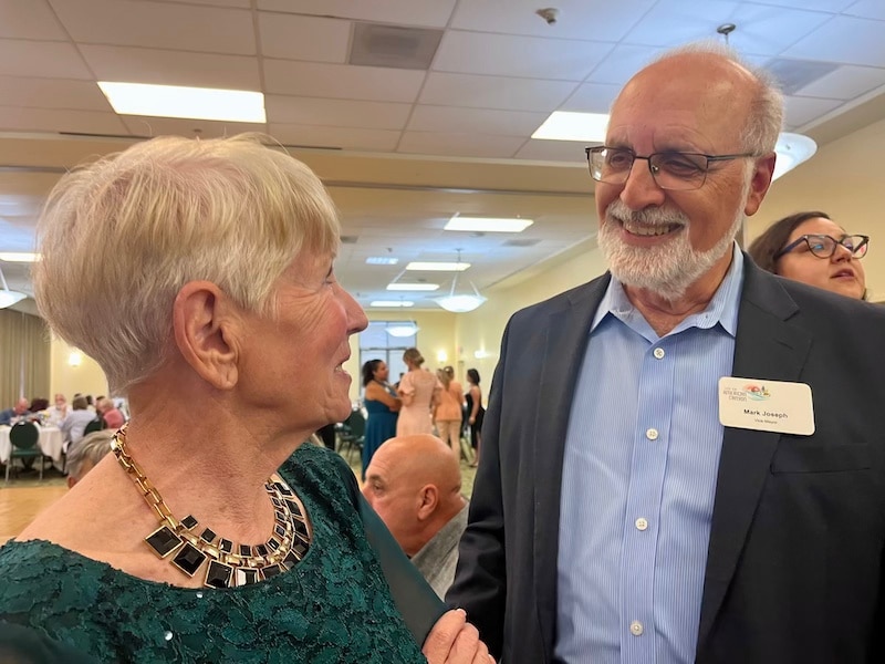 two people looking at each other talking